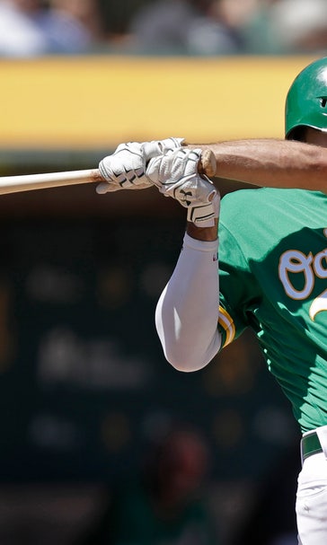 Chapman, Canha back Bassitt in A's 8-4 win over Astros